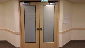 Doors with privacy frost film and graphic signage