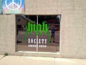 Dispensary dark reflective window film and signage graphics