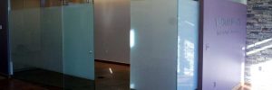 Glass office space with privacy window film crop