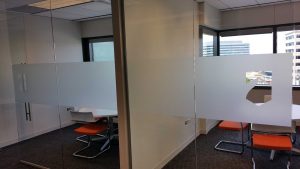 Office space with window frost privacy film and custom logo