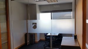 Office space with window frost privacy film and custom logo