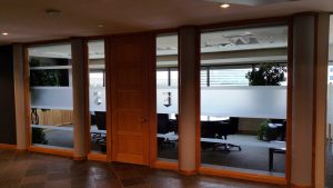 Office space with window frost privacy film and custom logo